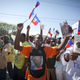 Aristide supporters wait for him to arrive at the airport. (Lee Celano/Getty Images)